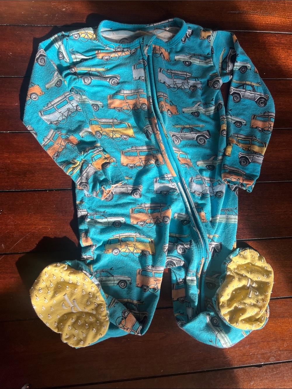 Posh Peanut Teal Vehicle-Print Footed One-Piece with Yellow Accents